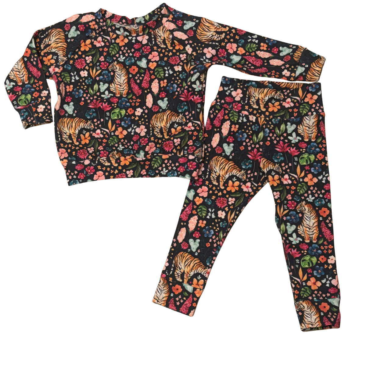 Children's pajama set with tiger and floral pattern on a navy blue background