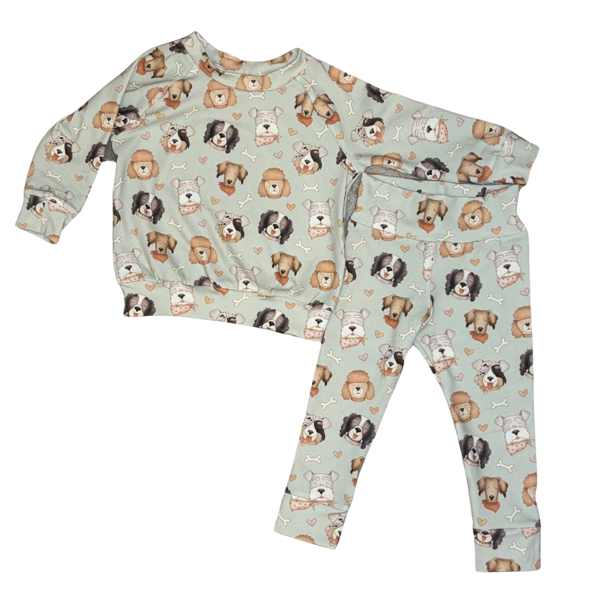 Children's pajama set with dog pattern on a light blue background